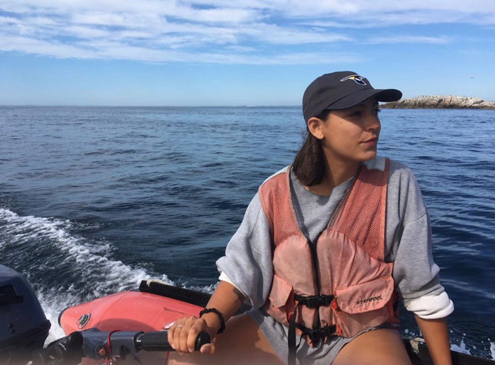 Aliya Caldwell steering boat in ocean