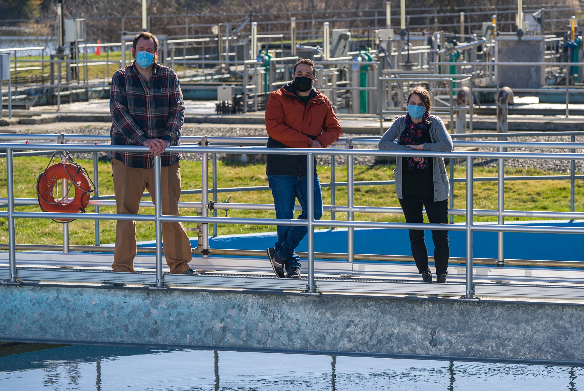 Paula Mouser and lab members Kellen Sawyer ‘21G (left) and Fabrizio Colosimo, postdoctoral researcher (center) sample for viral biomarkers of COVID-19 at Durham’s wastewater treatment plant.